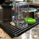 If you don’t have a ton of space in your kitchen, Ahyuan’s Roll up Dish Drying Rack packs down to the size of a rolling pin when not in use,and extends across a side of your sink when you need it.